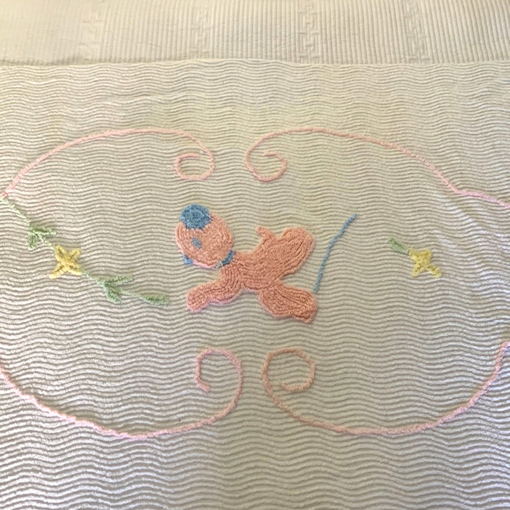 Vintage chenille baby bedspread with animal and floral motifs.